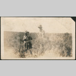 Two people standing in field (ddr-densho-293-203)