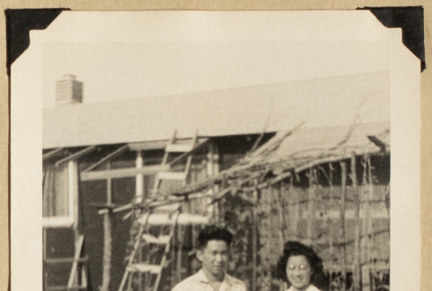 Gary Kikawa and woman beside a garden (ddr-densho-542-533)