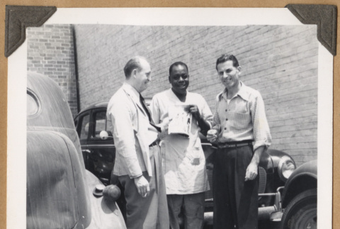 Three men outside a building (ddr-densho-542-93)