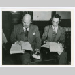 Charles Martin and Edward C. Reischauer reading the case against Japanese war criminals (ddr-densho-1007-404)
