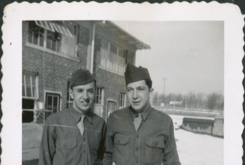 Two men standing outside building (ddr-densho-434-482)