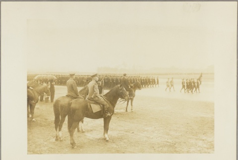 Military commanders on horseback watching a procession of soldiers (ddr-njpa-13-1185)