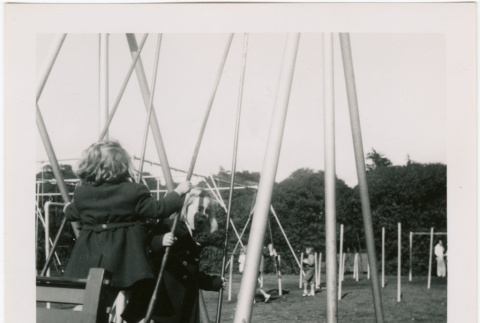 Children on swings at a park (ddr-densho-426-2467)
