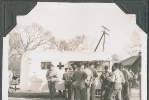 Group of men by Red Cross canteen truck (ddr-ajah-2-475)