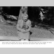Bertha Starkey sitting on a log (ddr-densho-336-57)