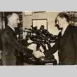 Two men shaking hands (ddr-njpa-1-1419)