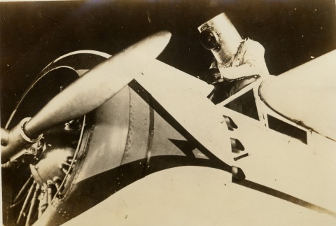 Wiley Post getting in/out of his plane in a pressurized suit (ddr-njpa-1-1322)