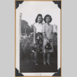 Two women standing with handbags (ddr-densho-542-331)