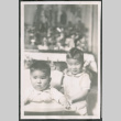 Photo of two children, one in a high chair (ddr-densho-483-753)