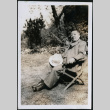 Man reclines in a chair (ddr-densho-395-91)