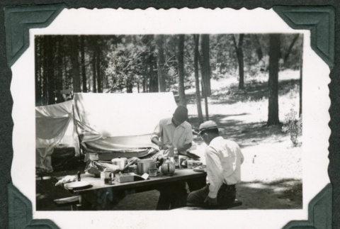 Two men at picnic table (ddr-densho-475-664)