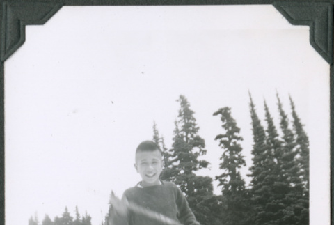 Photo of Paul Ima on a glacier with a stick (ddr-densho-483-1325)