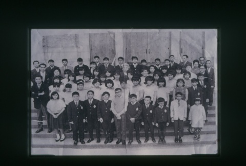 (Slide) - Image of group of boys and girls standing on steps of building (Maryknoll school) (ddr-densho-330-217-master-6778b1f6ba)