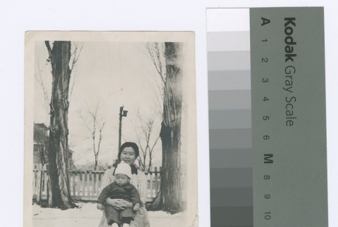 Woman and child in snowy yard (ddr-densho-255-96)