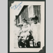 4 kids around a chair outside (ddr-densho-378-727)