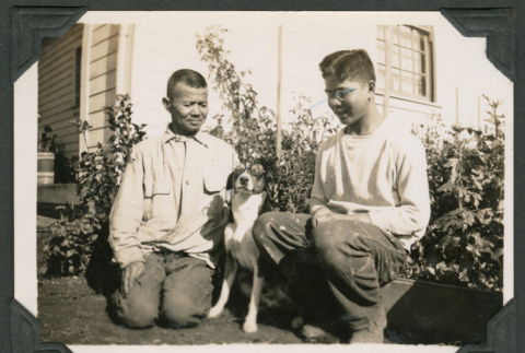 Photo of two men and a dog (ddr-densho-483-222)