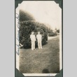 Two children stand in front of bush (ddr-densho-321-23)