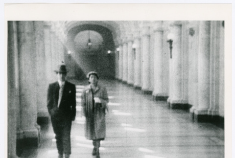 Man and woman walking through a hall (ddr-densho-1007-390)
