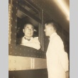 Shinzo Koizumi speaking to a man from a train window (ddr-njpa-4-484)