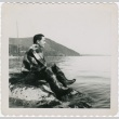 Eiichi Yamashita sitting on the shore (ddr-densho-296-96)