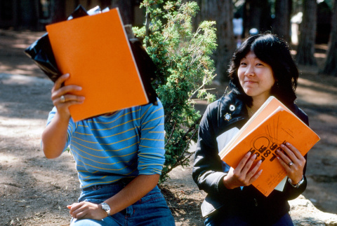 Emi Takizawa and Linda Kato holding their scrapbooks (ddr-densho-336-1067)
