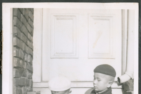 Two boys sitting on stoop (ddr-densho-483-536)