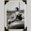 Child poses on car hood (ddr-densho-359-1644)