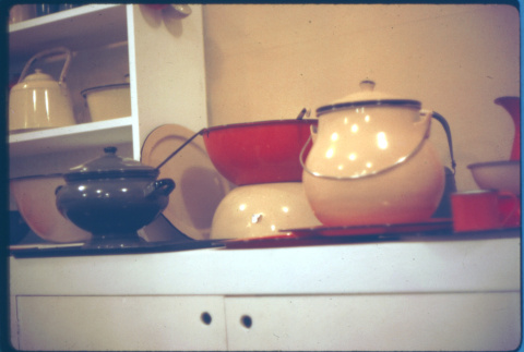 Display of enamelware pots, bowls (ddr-densho-426-319)