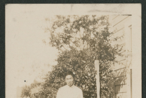 man next to tall bush (ddr-densho-378-742)