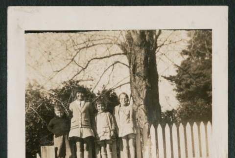 4 kids standing on a fence (ddr-densho-378-368)