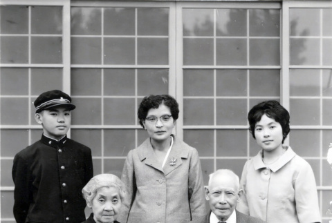 Portrait of Hashiguchi family holding photo of Kenji Hashibushi (ddr-densho-474-190)