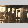 A man on a train with others (ddr-njpa-4-2164)