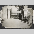 Men outside gate to cemetery at Castelfiortenino (ddr-densho-466-690)