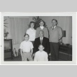 Group photo in front of Christmas tree (ddr-densho-333-60)