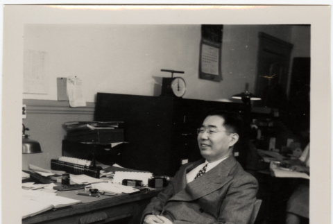 Man seated at desk (ddr-densho-426-944)
