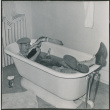 Man asleep in bathtub (ddr-densho-523-270)