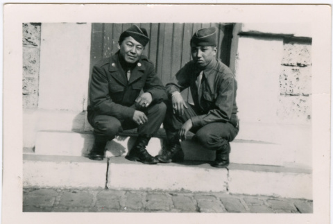 Two men sitting in doorway (ddr-densho-458-54)