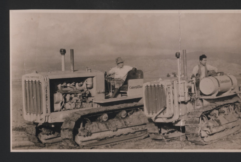Yonezo and Charles Ichikawa and two employees on tractor (ddr-csujad-55-2588)