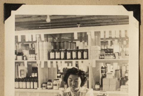 Rose Nomura at a warehouse (ddr-densho-542-530)
