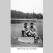 Rev. John Miyabe and Steve Nakashima kneeling on a rock (ddr-densho-336-66)
