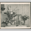 Flowers in a vase on a table (ddr-densho-293-107)