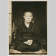 A woman seated in a doorway (ddr-densho-296-18)