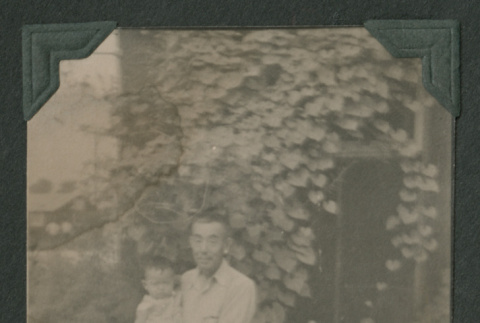 Man holding child (ddr-densho-471-113)