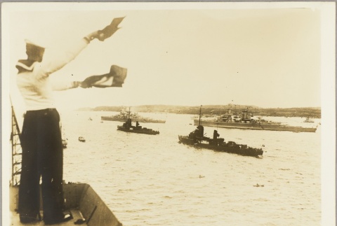 German sailor signaling ships entering a harbor (ddr-njpa-13-982)