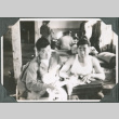 Men sitting on cot in barracks (ddr-ajah-2-393)