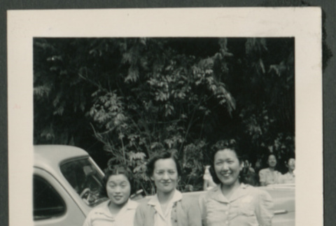 Three women in front of car (ddr-densho-359-199)