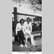 Man and woman sitting on bench (ddr-ajah-6-69)