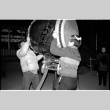 Kenny and one other lifting drum (ddr-densho-1007-1224)