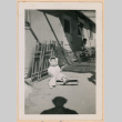 Baby sitting outside barracks (ddr-densho-329-1294)
