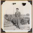 Man standing beside a garden (ddr-densho-542-144)